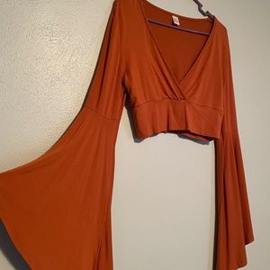 Burnt orange bell sleeve crop top